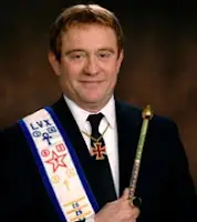 David Griffin the Imperator of the Hermetic Order of the Golden Dawn shown with his regalia clutching wand