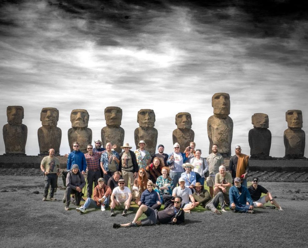 Adept Expeditions tour group with Anyextee and Jahannah James in front of Moai statues on Easter Island