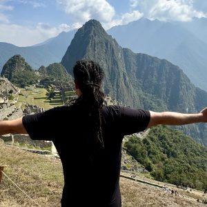 Anyextee stands before Machu Picchu